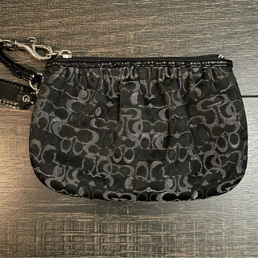 Black and silver COACH wristlet